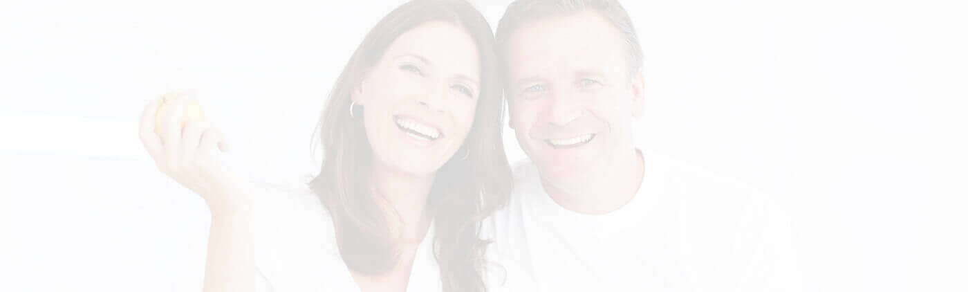 Fayetteville Restorative Dentistry Couple leaning on each other smiling