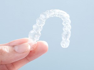 Patient holding clear aligner